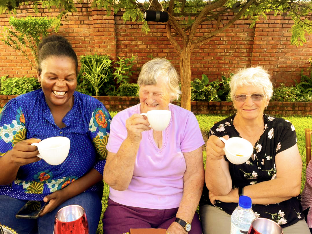 Friends laughing over coffee